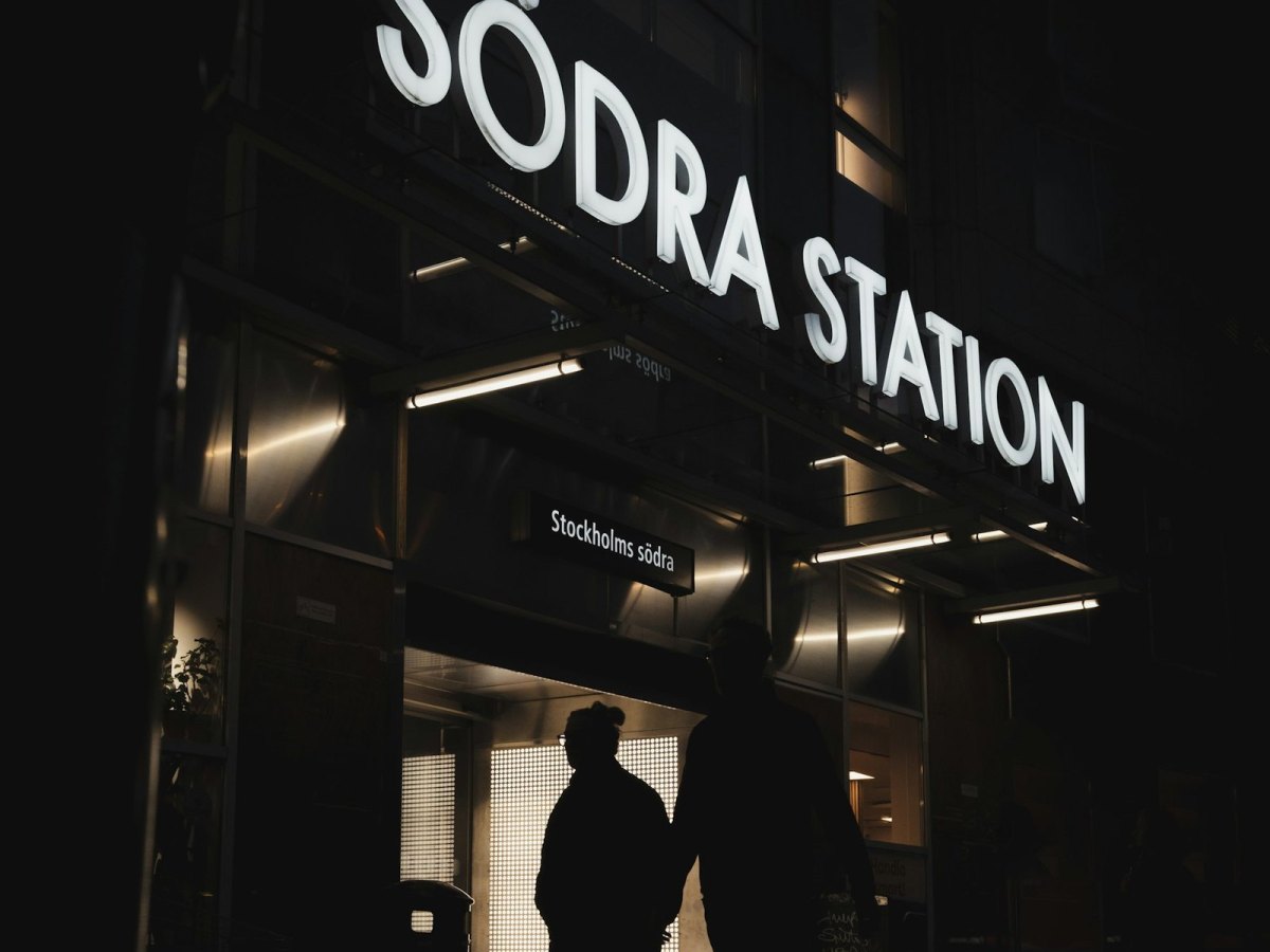 Stockholms södra at night — commuting through the city, faces unseen. Photo: Unsplash.